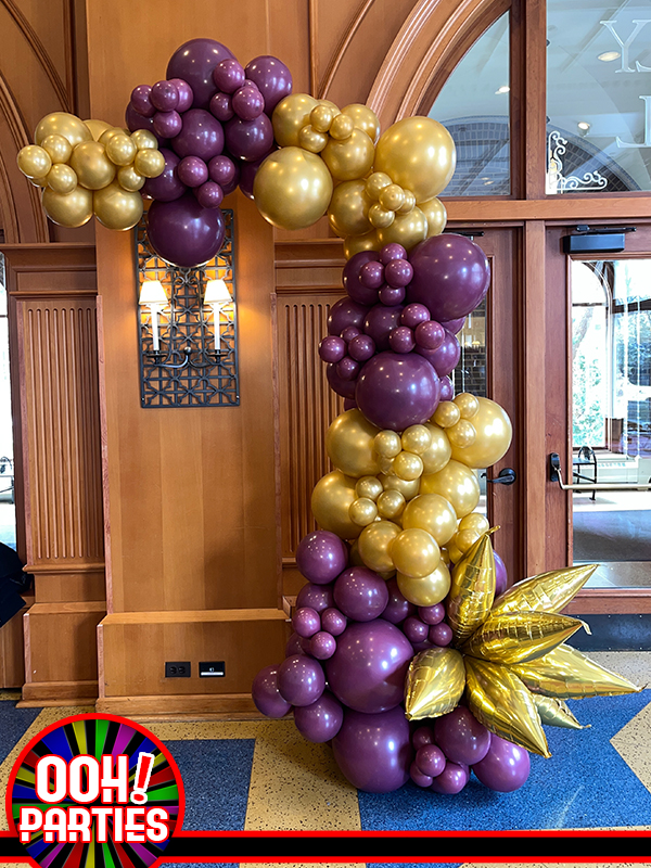 purple an gold balloon demi arch